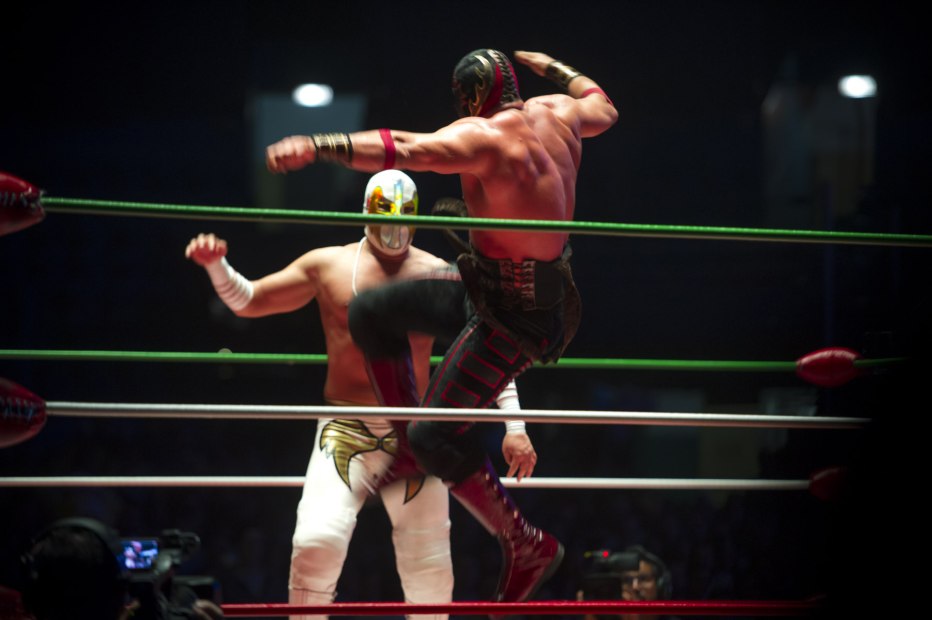 Two lucha libre wrestlers perform in the ring at Arena Mexico, photo
