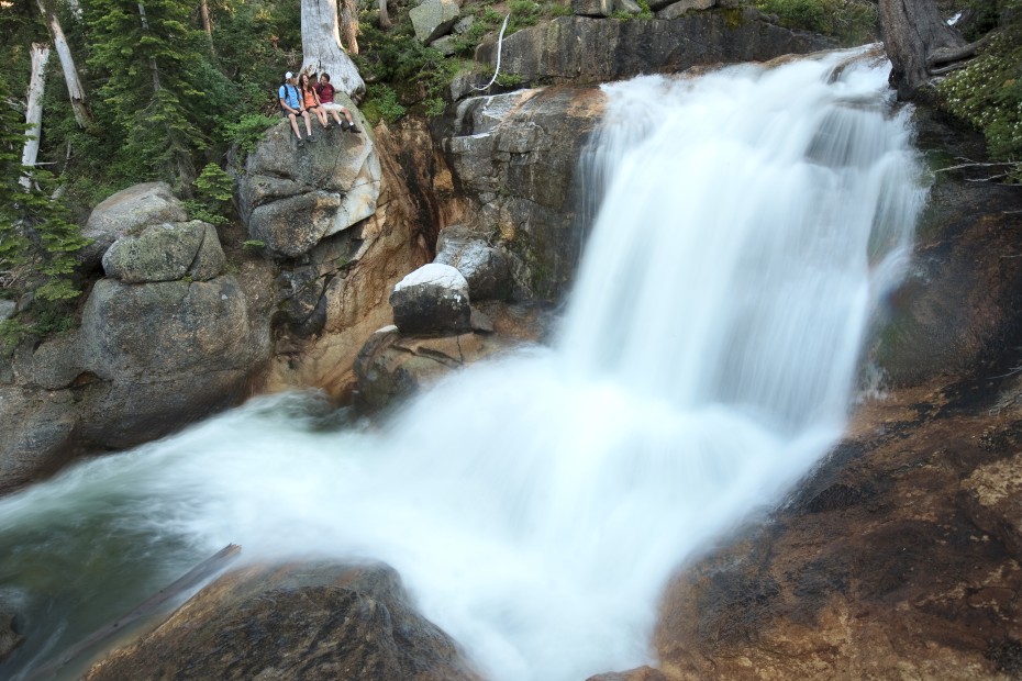 Hikers look out onto a waterfall at Squaw Creek along the Shirley Canyon Trail near Tahoe, photo
