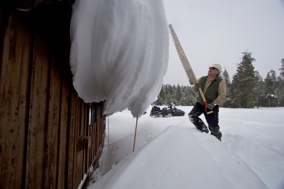 picture of Steve Fuller clearing snow at Yellowstone National Park in winter