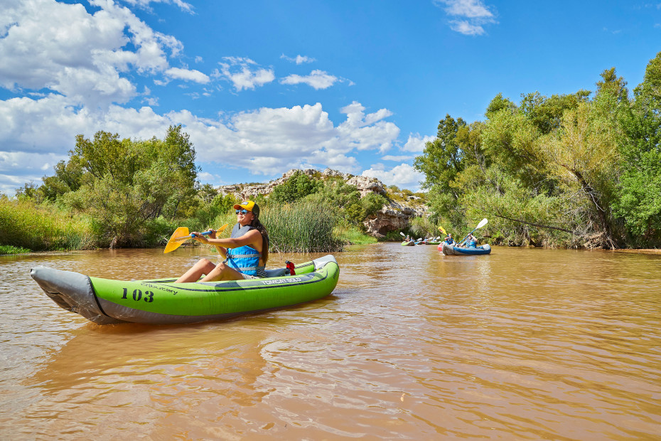 photo of kayakers on a muddy river