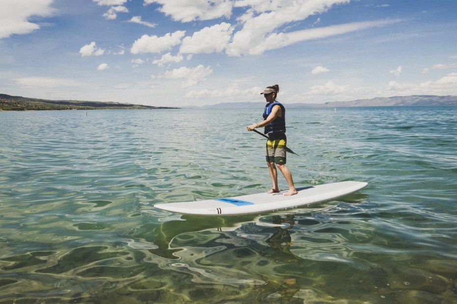 A paddleboarder glides on the azure waters of Bear Lake, Utah, picture