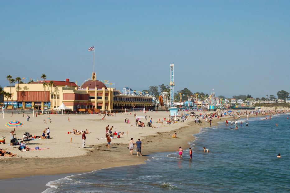 people play on Santa Cruz's Main Beach with the Boardwalk in the background, picture