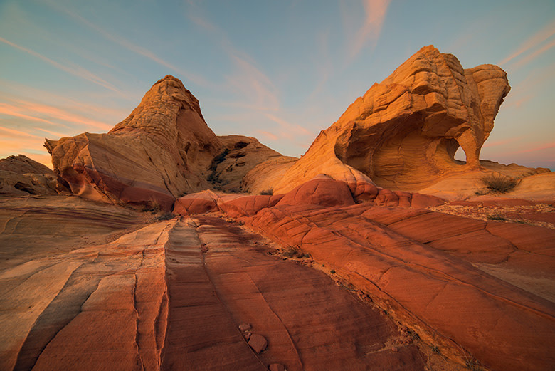 Piano Arch glows with red-magenta hue from low angle of light at Valley of Fire State Park northeast of Las Vegas, Nevada, picture