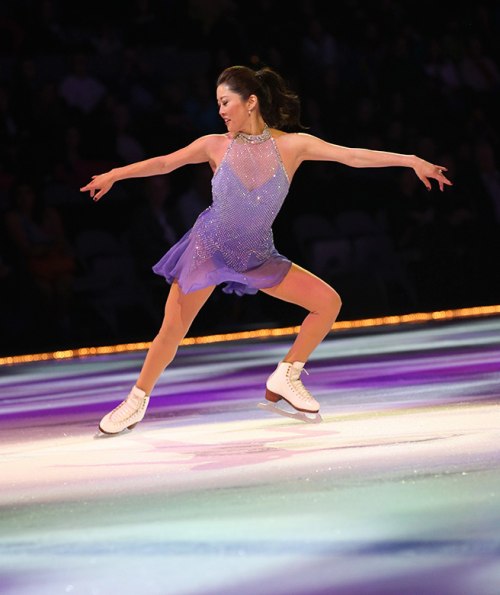 Kristi Yamaguchi skates and sparkles in her purple outfit at charity fundraiser, picture