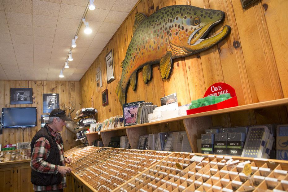 a customer browses the selection at Tackle Shop in Ennis, Montana. 