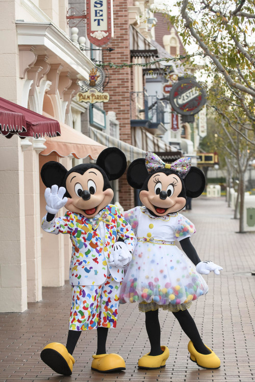 Minnie and Mickey in white, polka dotted clothes with yellow shoes to celebrate the Get Your Ears on Event 90th birthday party at Disneyland Resort in Anaheim, picture