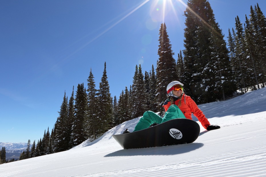 photo of a female snowboarder at park city mountain resort