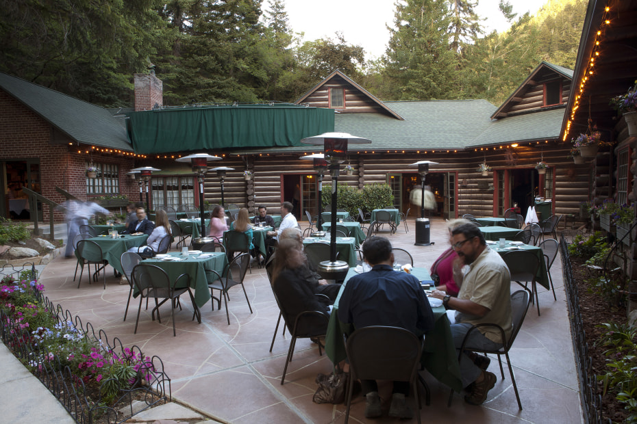 diners enjoy dinner on the cozy patio at Log Haven in Salt Lake City, Utah, picture