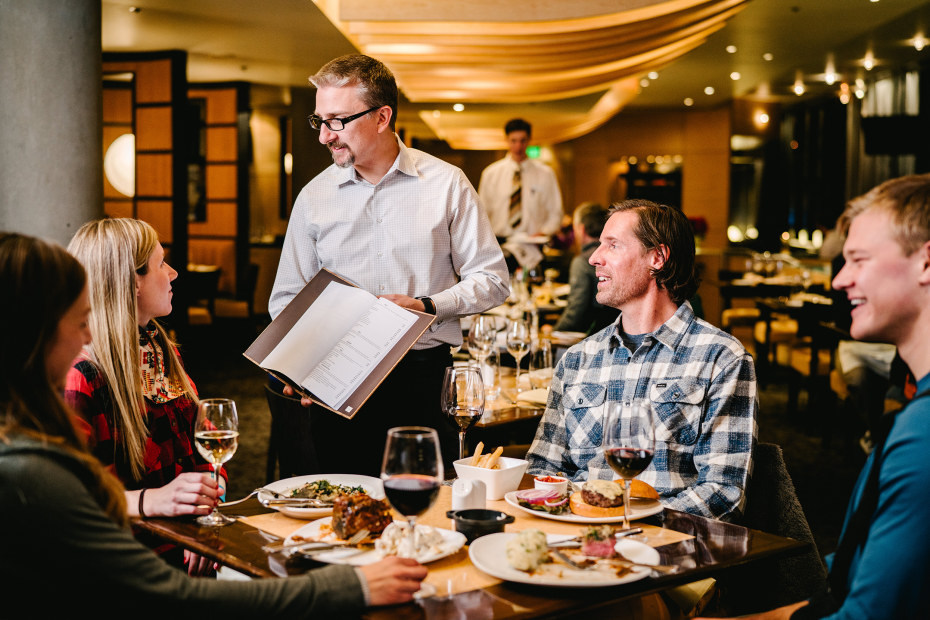 guests consider the wine list at the Aerie in Salt Lake City, Utah, picture