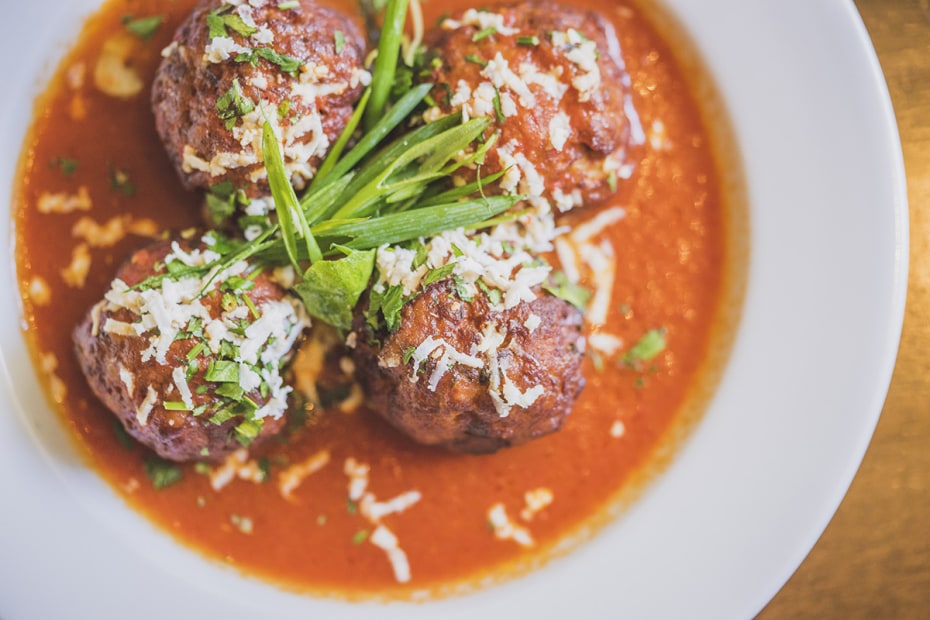 plate of meatballs in red sauce at La Balena restaurant in Carmel