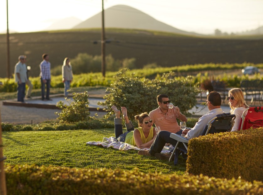 visitors to Baileyana drink wine in the sun and play bocce ball near San Luis Obispo, California, picture