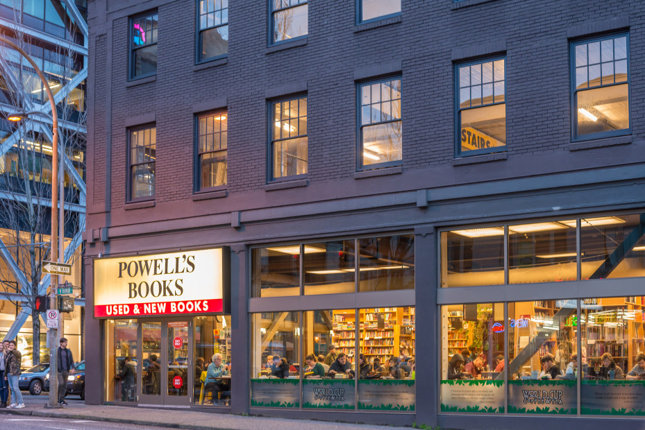 Powell's cafe and bookstore lit up from the inside, image