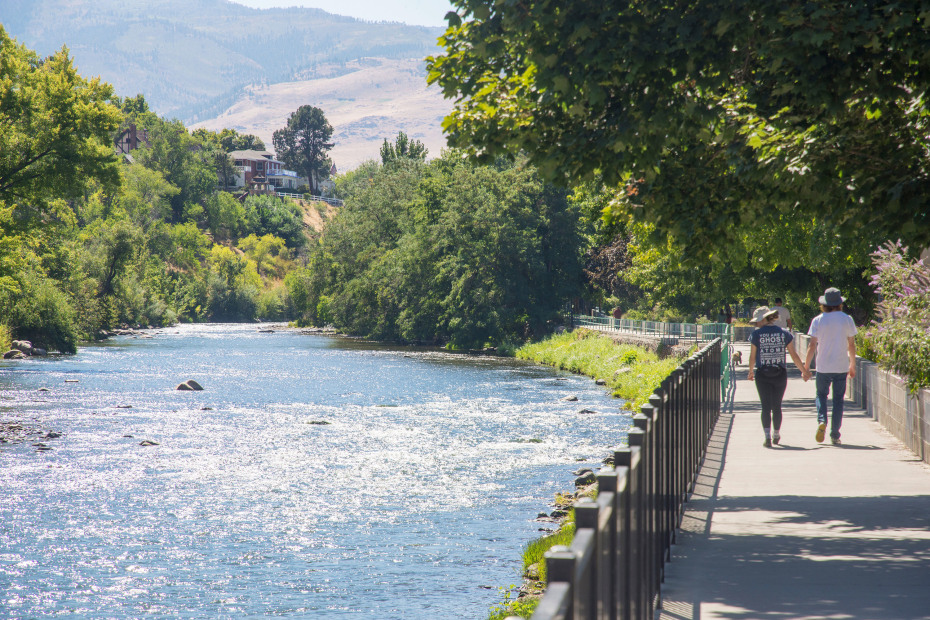 A couple walks along the Truckee River path in Reno, picture