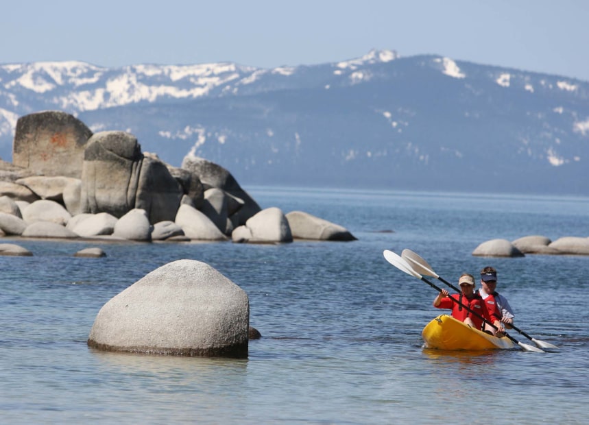 couple kayaking near rock formations at Lake Tahoe, picture