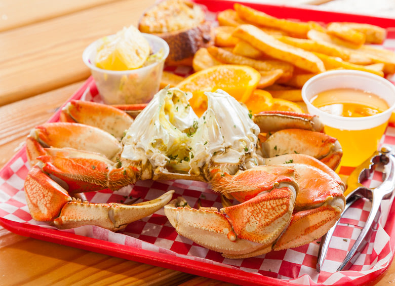 Dungeness crab with drawn butter and fries at Luna Sea Fish House in Yachats, Oregon, picture
