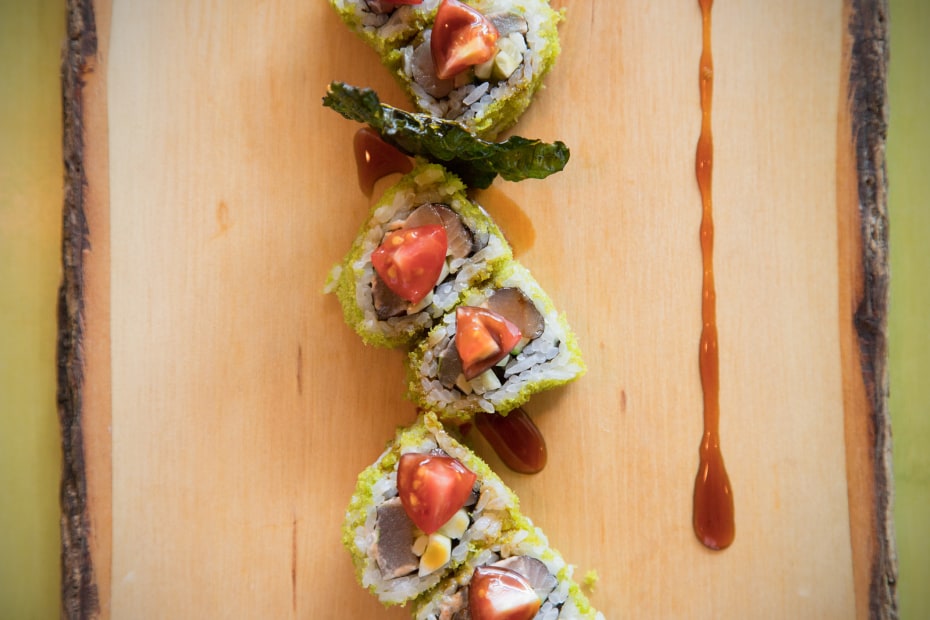 the grinch roll with cherry tomato topping from tona sushi in ogden, utah