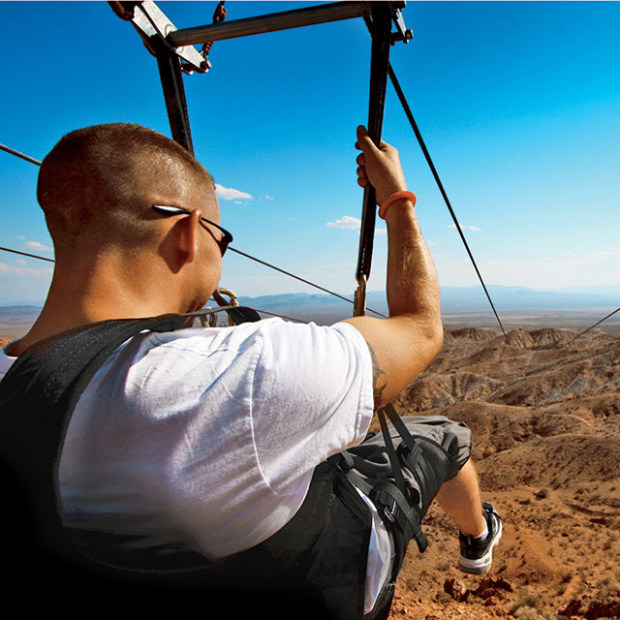 man rides on Flightlinez zip line, Las Vegas, Nevada, image