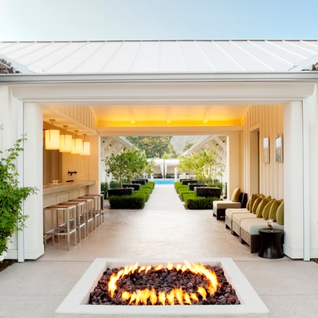 fire pit burns in front of entrance to bathhouse at Solage spa in Calistoga, California, picture