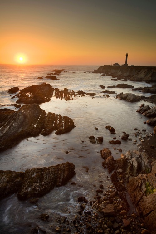 The sun sets behind Point Arena Lighthouse.