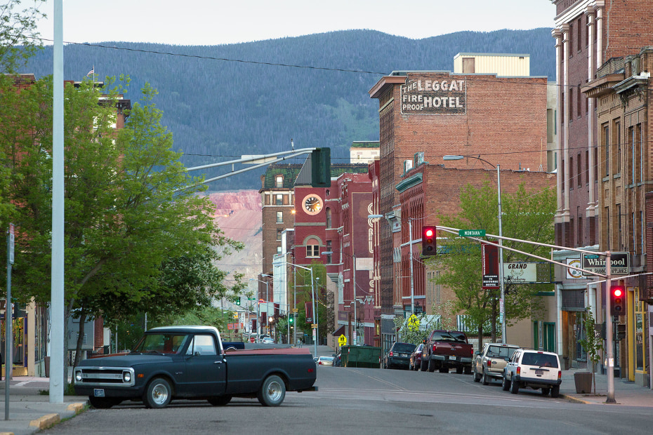 downtown street scene with mountain in background in Butte, Montana, picture