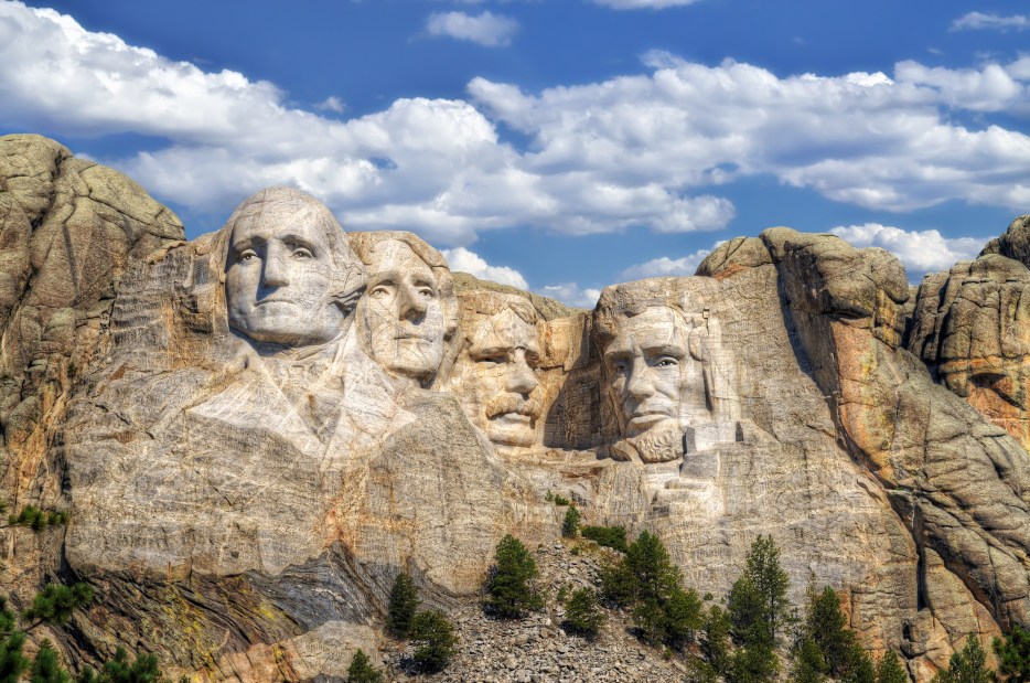 Mt. Rushmore on a partly cloudy day.