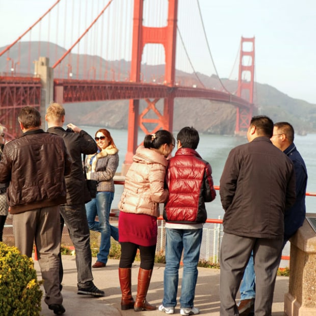 visitors in warm clothing enjoy the view of the Golden Gate from Strauss Plaza, San Francisco, picture