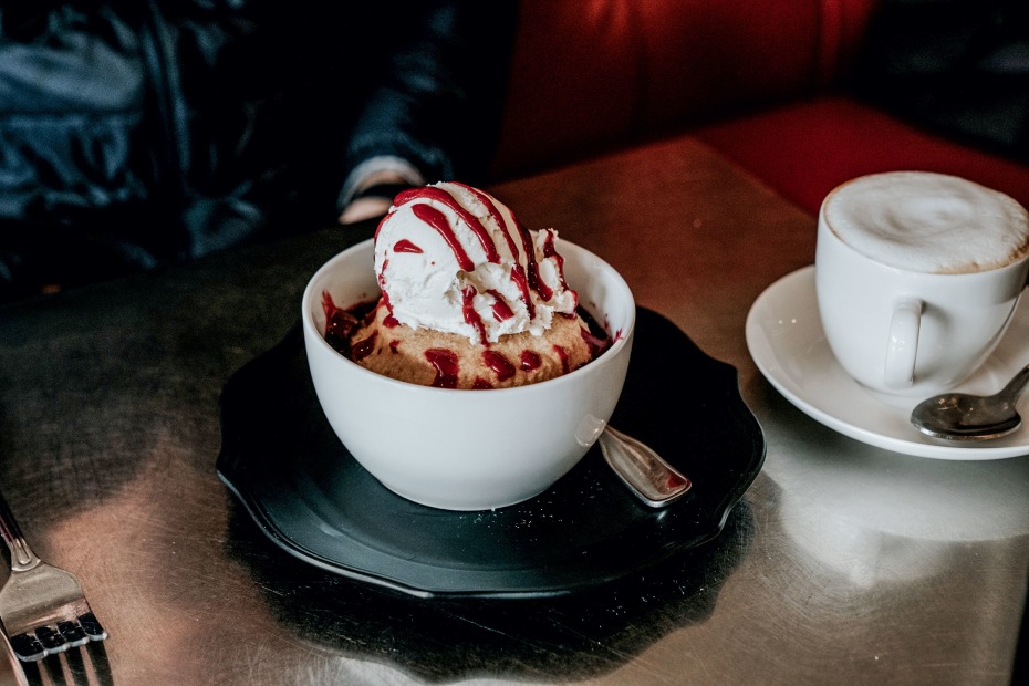 Mixed berry cobbler accompanied by cappucino at Wild Pear in Salem, Oregon