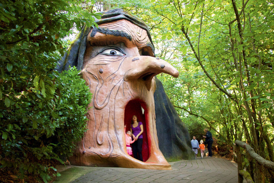 Woman and young girl marvel at the Witch's interior in the Enchanted Forest in Salem, Oregon