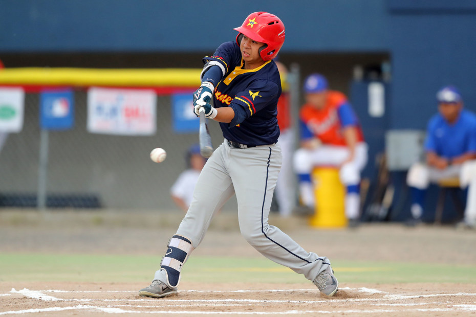 left-handed batter swings at pitch at Midnight Sun baseball game in Fairbanks, Alaska, picture