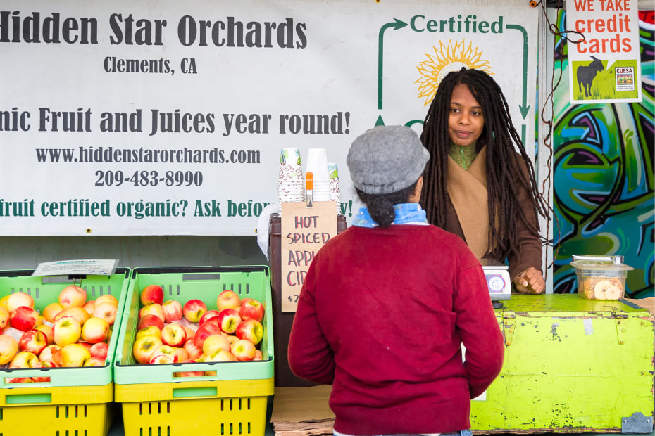 Hidden Star Orchards sells organic juice and cider at the Grand Lake-Oakland Farmers Market, image