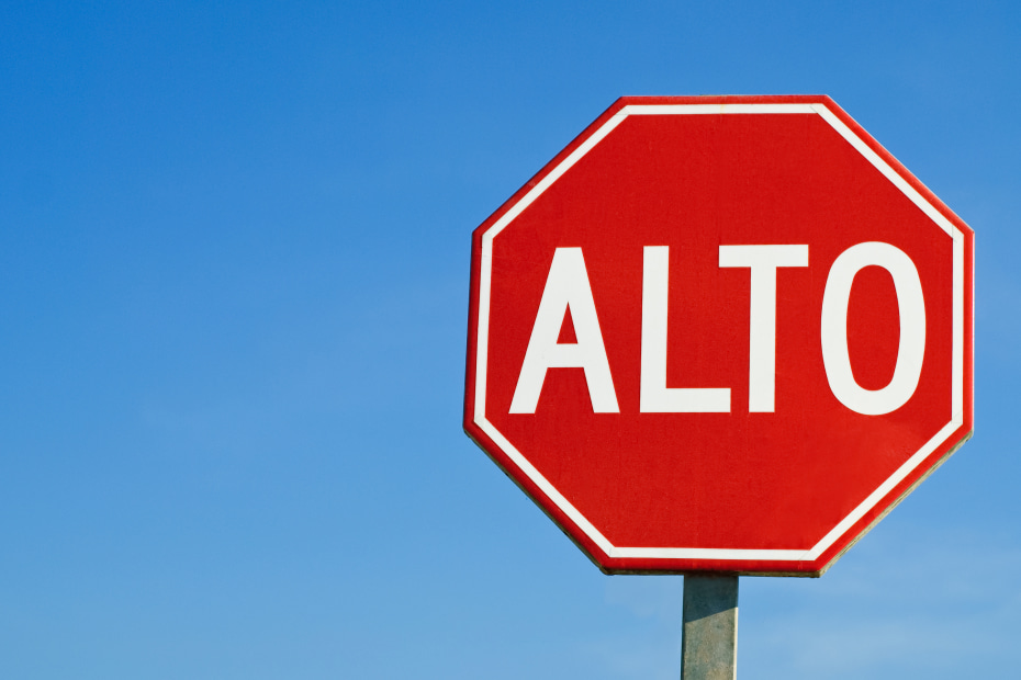 Red and white alto sign in Mexico, image