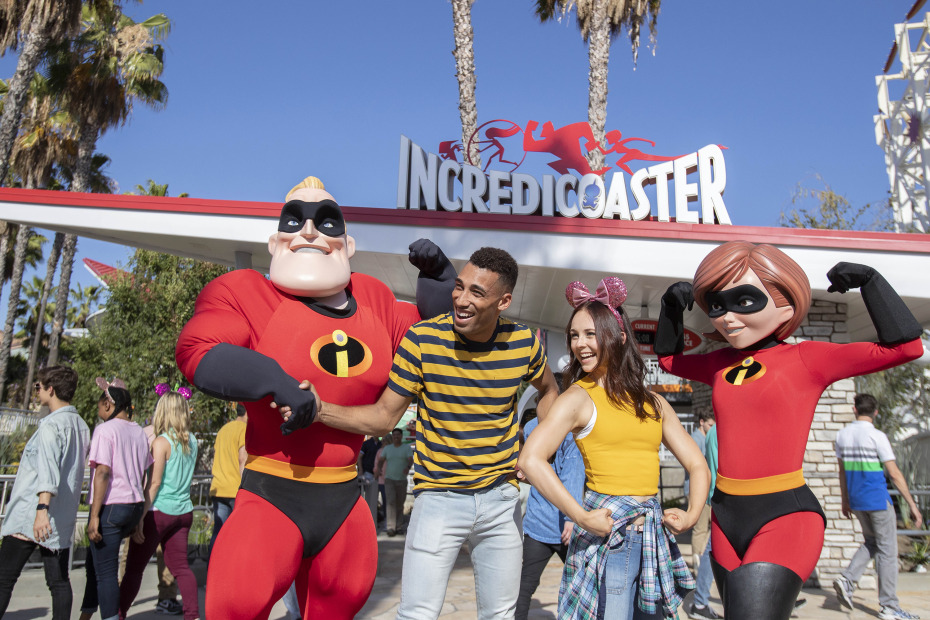 The Incredibles pose with visitors in front of the Incredicoaster at Disneyland's California Adventure, image