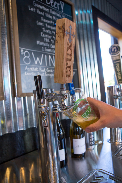 filling a pint with craft beer at the Podski in Bend, Oregon, picture