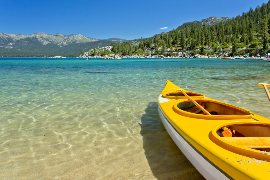 A rented canoe rests on the shore of Lake Tahoe