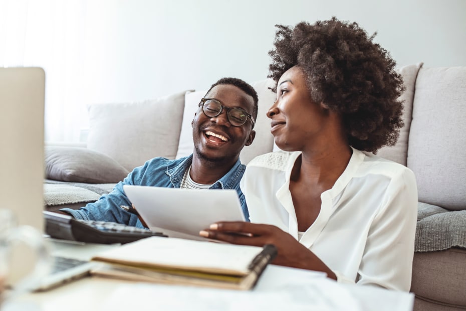 A couple go through their finances to buy a home.