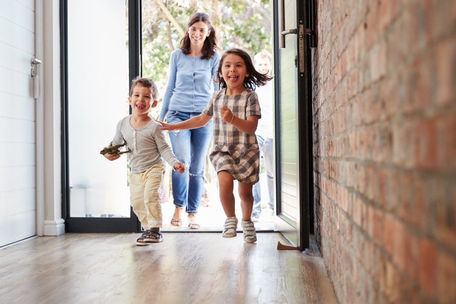 A family attends an open house for a house for sale.