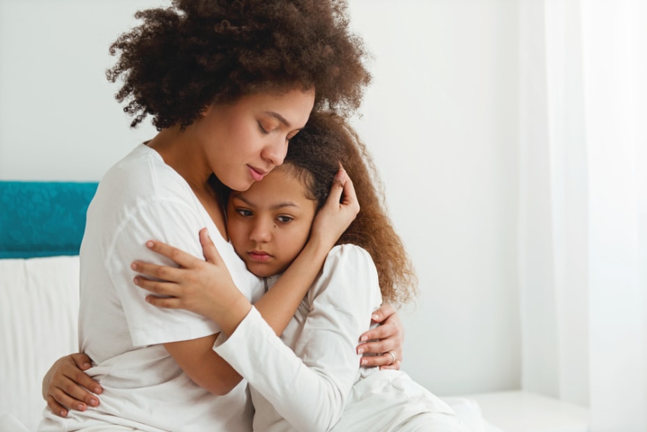 A AAA member comforts her daughter after an earthquake