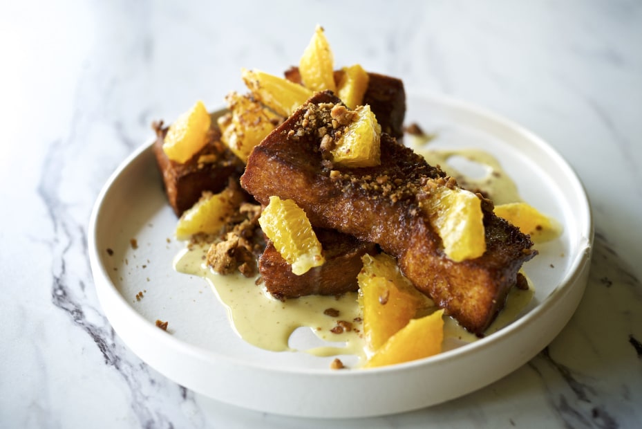 French toast strips topped with orange chunks and chopped walnuts served in white deep-dish at Portland's Canard