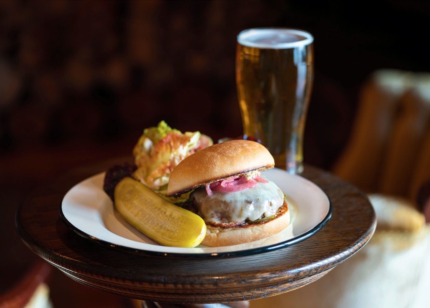 Lardo burger with red onion and melted cheese, pickle on side, and a pint at Watershed at the Owl in Grass Valley, California