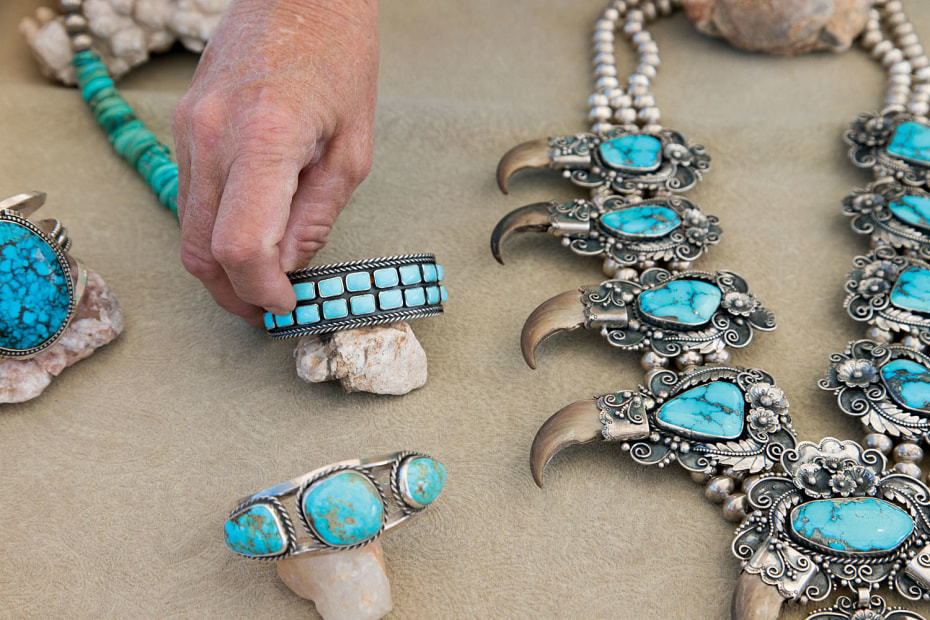 turquoise necklace by Rick Bradshaw displayed with other turquoise jewelry pieces at the Farmers & Crafts Market in Las Cruces, New Mexico