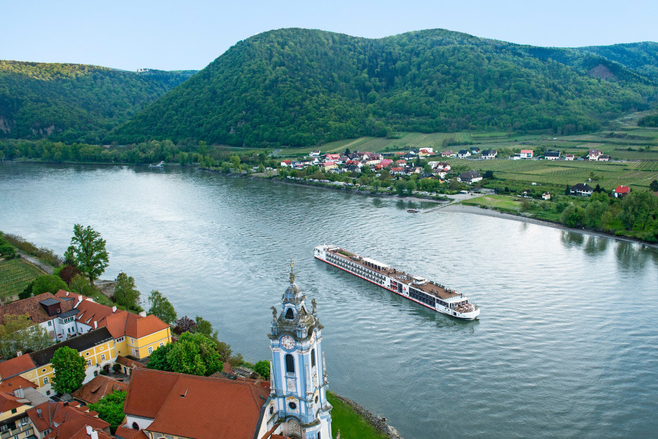 A Viking Longship glides past Dürnstein, Austria.