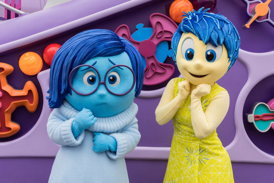 Sadness and Joy Inside Out characters pose at Pixar Pier
