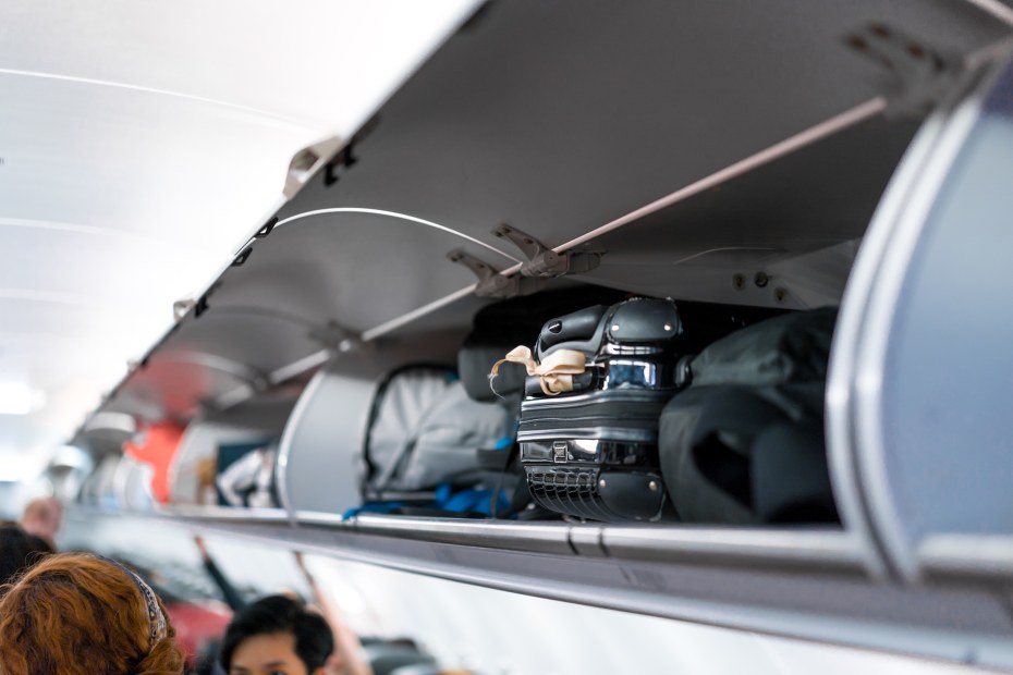 full airplane overhead bin.