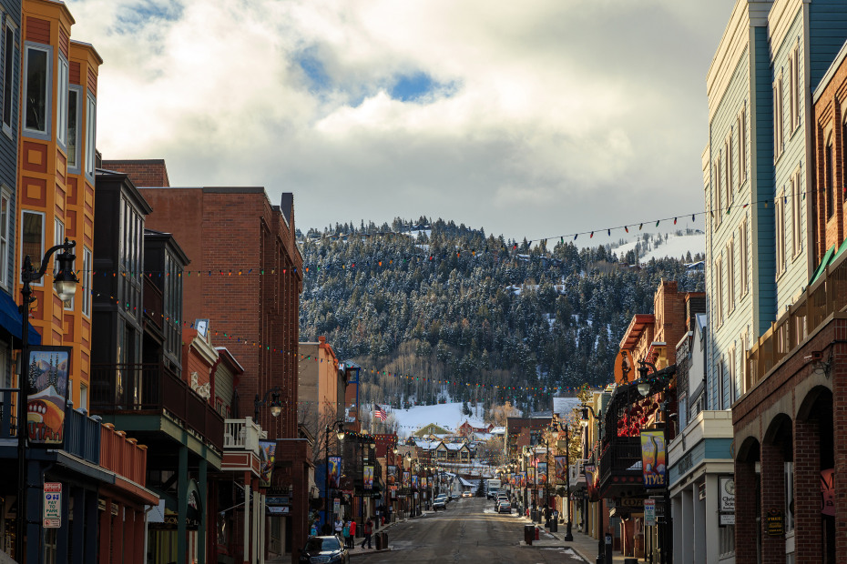 Snow capped mountains behind Main Street in Park City, Utah.