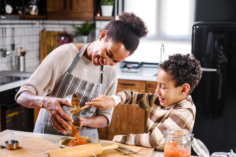 AAA Member and her son make a pumpkin pie together.