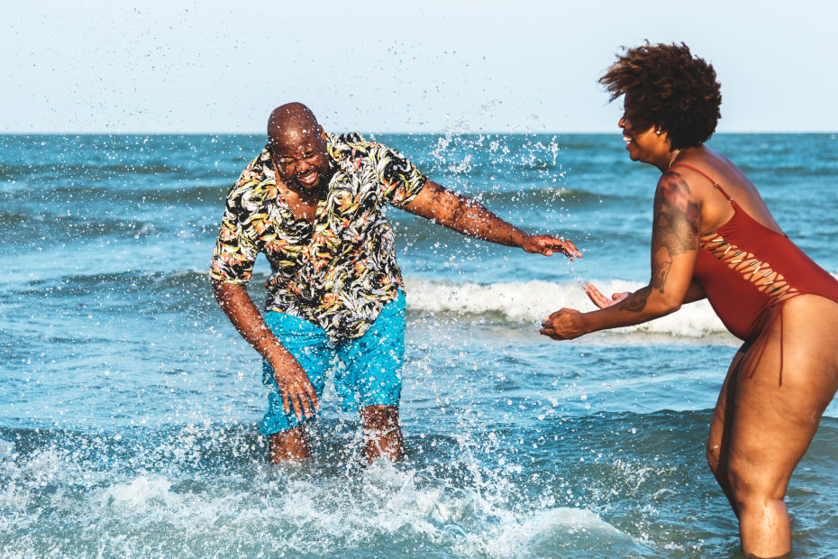 AAA Members play in the ocean.