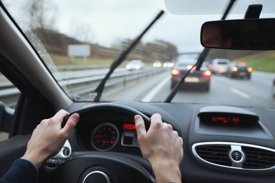 AAA Member uses their windshield wipers on a rainy day.