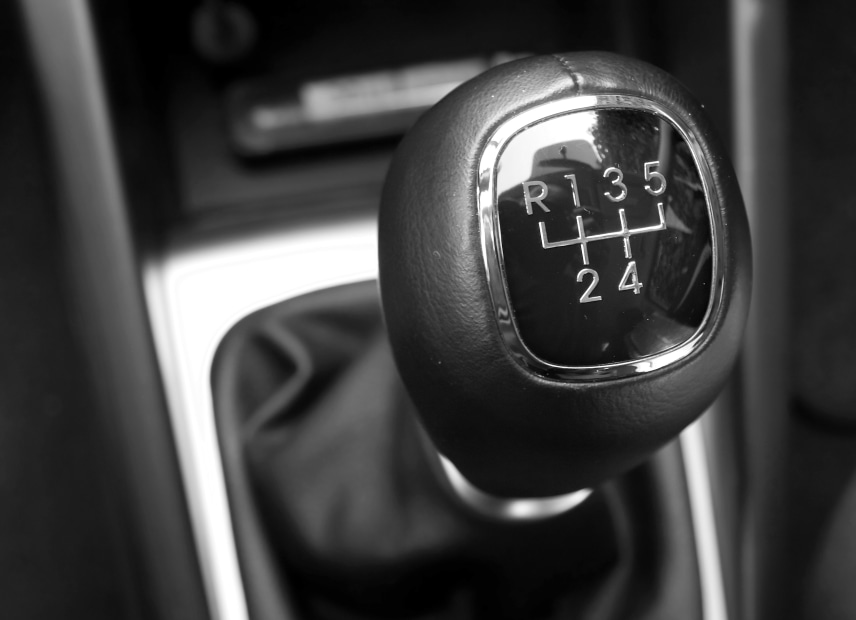 close-up of a gear shift in a car with a manual transmission