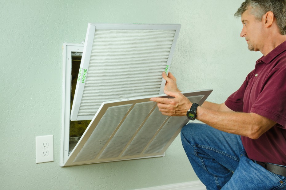 AAA Member replaces home heating and cooling system's air filter.