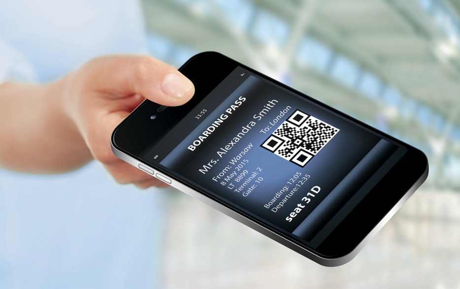 phone in hand with app as paperless boarding pass